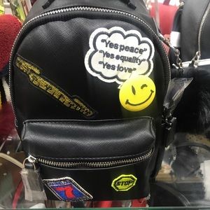 Mini backpack with black fur ball